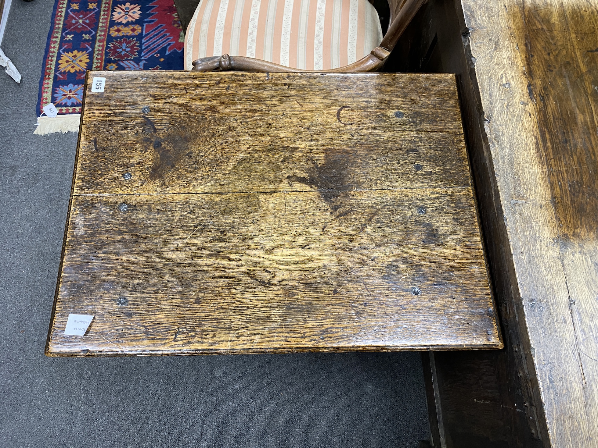 A late 17th century William and Mary small rectangular oak centre table, with arched apron, on square and baluster turned legs, joined by H-stretcher, width 72cm, depth 53cm, height 69cm